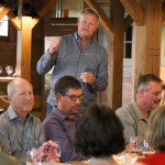Kris Kristoferson speaks to guests at a farm dinner at Kristoferson Farms on Camano Island on June 11. (Ian Terry / The Herald)