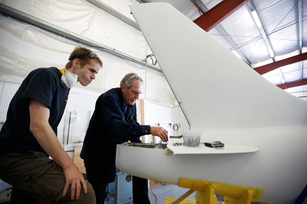 Dennis Willows, of Friday Harbor, works with mechanic Dan Holtz (left) to assemble his Glasair Sportsman aircraft at the company&rsquo;s manufacturing facility in Arlington on June 22. (Ian Terry / The Herald)