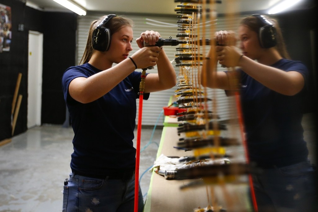 Weyauwega-Fremont High School student Natasha Stemwedel rivets the wing of a Glasair Sportsman aircraft at the company&rsquo;s manufacturing facility in Arlington on June 22. (Ian Terry / The Herald)