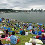 A crowds fills the hillside before the Fourth of July celebration at Gas Works Park in Seattle Monday night. (Genna Martin / seattlepi.com via AP)