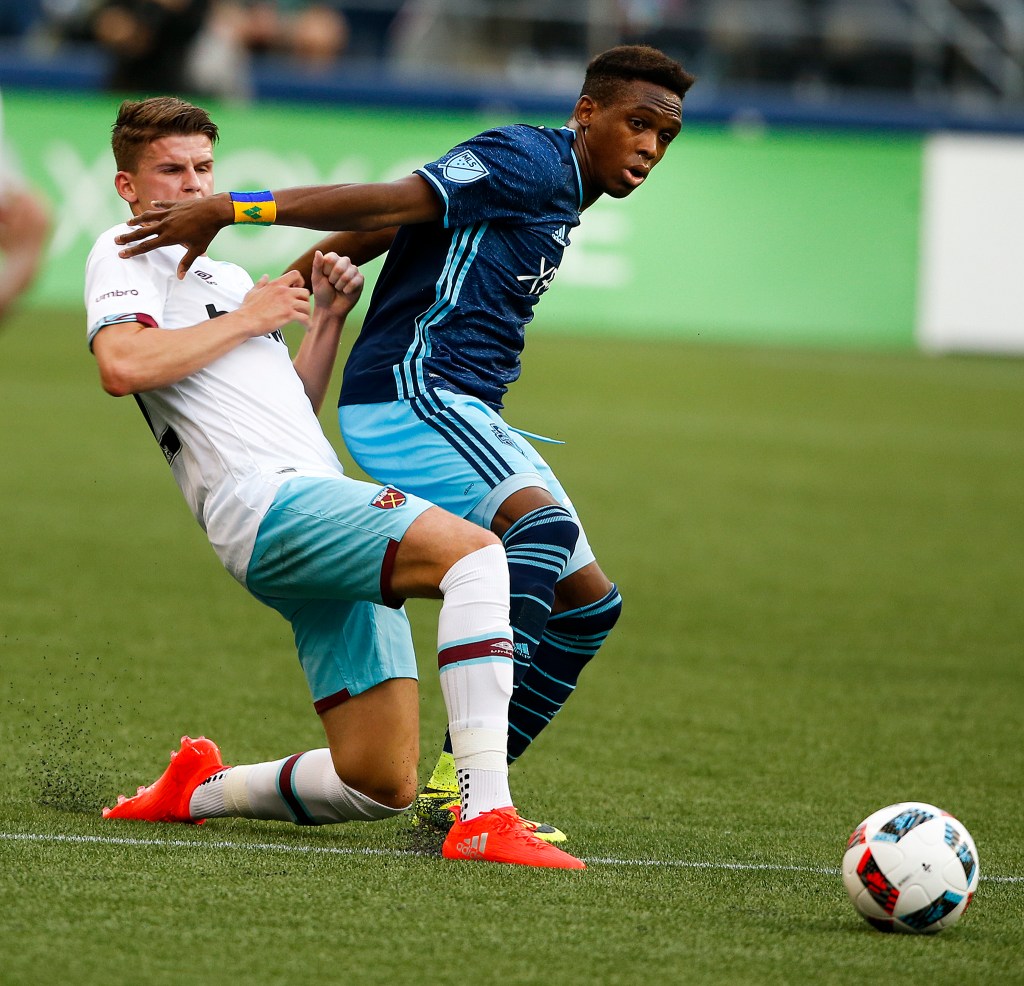 Seattle Sounders forward Oalex Anderson (right) fends off West Ham United&rsquo;s Sam Byram during an international friendly match at CenturyLink Field in Seattle on Tuesday. (Ian Terry / The Herald)
