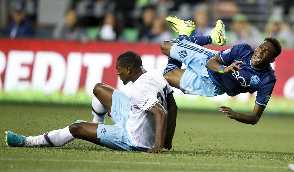West Ham United&rsquo;s Doneil Henry (left) comes in for a hard tackle against Seattle&rsquo;s Oalex Anderson during an international friendly match at CenturyLink Field in Seattle on Tuesday. (Ian Terry / The Herald)