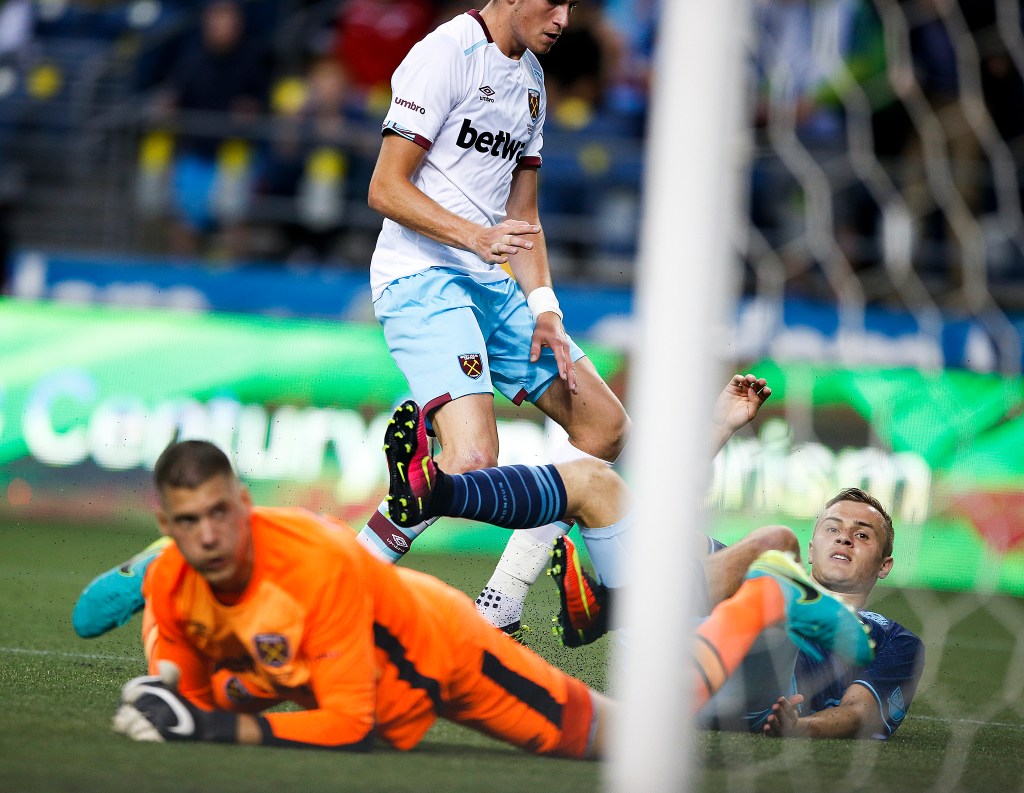 Seattle&rsquo;s Jordan Morris (right) watches as his shot rolls in for a goal during an international friendly match against West Ham United at CenturyLink Field in Seattle on Tuesday. (Ian Terry / The Herald)