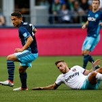 Sounders midfielder Cristian Roldan (left) gains control of the ball after a tackle on West Ham United&rsquo;s Diego Poyet during an international friendly Tuesday at CenturyLink Field in Seattle. (Ian Terry / The Herald)