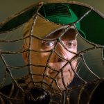 Ron LaCount looks through one of his stained glass pieces at Providence Regional Cancer Partnership. A cancer survivor and Parkinson&rsquo;s patient, LaCount, creates art from stained glass and old Harley motorcycle parts, leather and more. He leads some of the art therapy support groups and is known for wearing his artistic top hat to make people smile. He is a 21-year Navy veteran, served five years at Everett Naval Station and worked 14 years in the local shipyards. (Andy Bronson / The Herald)