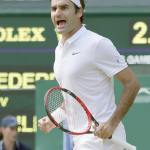 Roger Federer celebrates a point against Marin Cilic during their quarterfinal match at Wimbledon on Wednesday in London. Federer rallied for a five-set victory. (AP Photo/Tim Ireland)