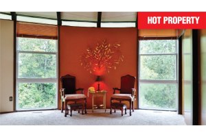 Round home with lake, mountain views