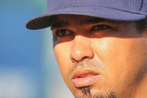 Kevin Clark / The Daily Herald                                AquaSox pitching coach Moises Hernandez, the older brother of Mariners ace Felix Hernandez, talks with Yojhan Quevedo (left) and Reggie Lewis (right) before a game Wednesday at Everett Memorial Stadium. (Kevin Clark / The Herald)