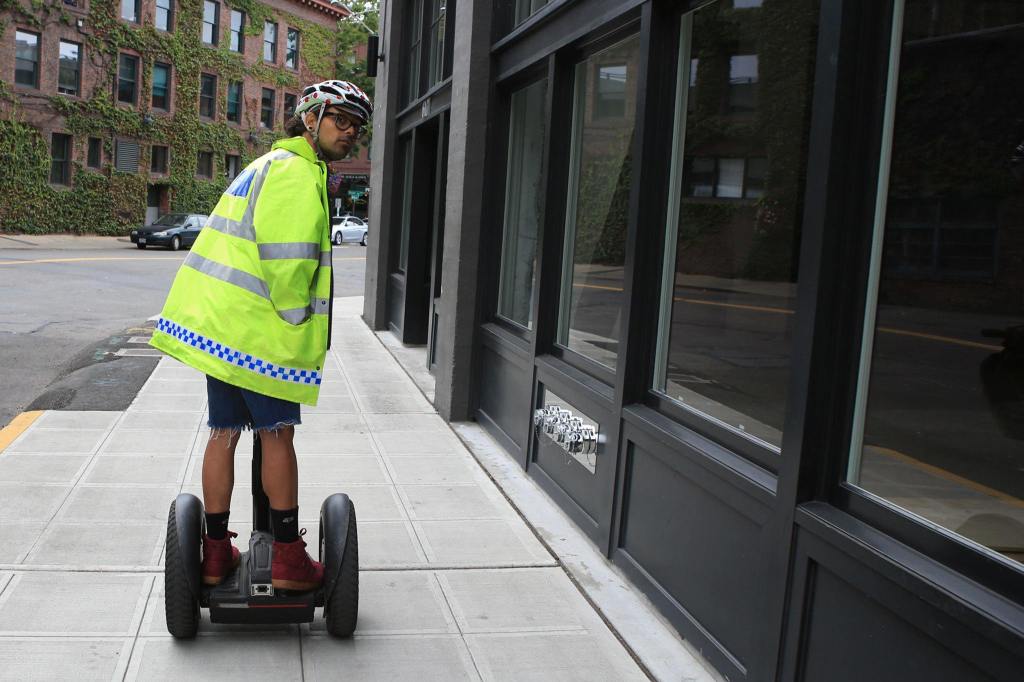 Jonathan Martinez, 27, leads a Segway tour through downtown Seattle and Seattle Center. (Kevin Clark / The Herald)
