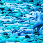 People maneuver into position as they take part in a mass nude art installation entitled Sea of Hull by New York based artist Spencer Tunick in Hull, England, on Saturday. (Danny Lawson / PA)
