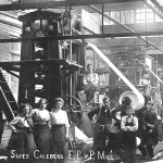 Women and boys pause during a work day at the Everett Pulp and Paper Mill in 1915 in Lowell. (Northwest History Room / Everett Public Library)