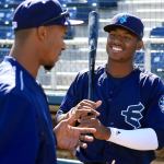 The AquaSox&rsquo;s Kyle Lewis (right) talks with hitting coach Brian Hunter during a workout on June 16 at Everett Memorial Stadium. (Kevin Clark / The Herald)