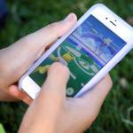 A teen battles in Pokemon Go at Grand Avenue Park in Everett on July 14, 2016. He was far from alone playing the augmented reality smartphone app game during the weekday afternoon. (Kevin Clark / The Herald)