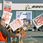 Engineer Tim Donahue (left) and about 100 other SPEEA members strike at Boeing&rsquo;s Everett plant on Feb. 9, 2000. (Justin Best / The Herald)