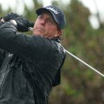 Mickelson shines in wind and rain, keeps British Open lead