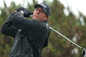 Mickelson shines in wind and rain, keeps British Open lead