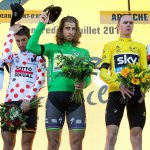 Tour de France riders, including overall leader Chris Froome of Britain (second from right) and stage winner Tom Dumoulin of Netherlands (right) prepare to observe a moment of silence to commemorate the victims of the Nice truck attack. The group was on the podium following the 13th stage Friday. (AP Photo/Peter Dejong)