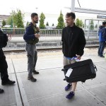 Snohomish County Sheriff&rsquo;s deputy Adam Malaby (left) and social worker Jesse Calliham (center left) say their goodbyes to Jared Gans, of Everett, as he gets ready to board a bus to Spokane for chemical dependency treatment, on July 7 at the Everett Station. &ldquo;This opportunity may not come around again,&rdquo; Gans, 29, said about treatment for his ongoing struggle with heroin and methamphetamine addiction. (Ian Terry / The Herald)