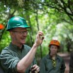 Northwest Youth Corps crew leader Cody Reidy signs to his fellow deaf crew members before they break for lunch after trail building at Ebey&rsquo;s Landing National Historical Reserve. (Andy Bronson / The Herald)