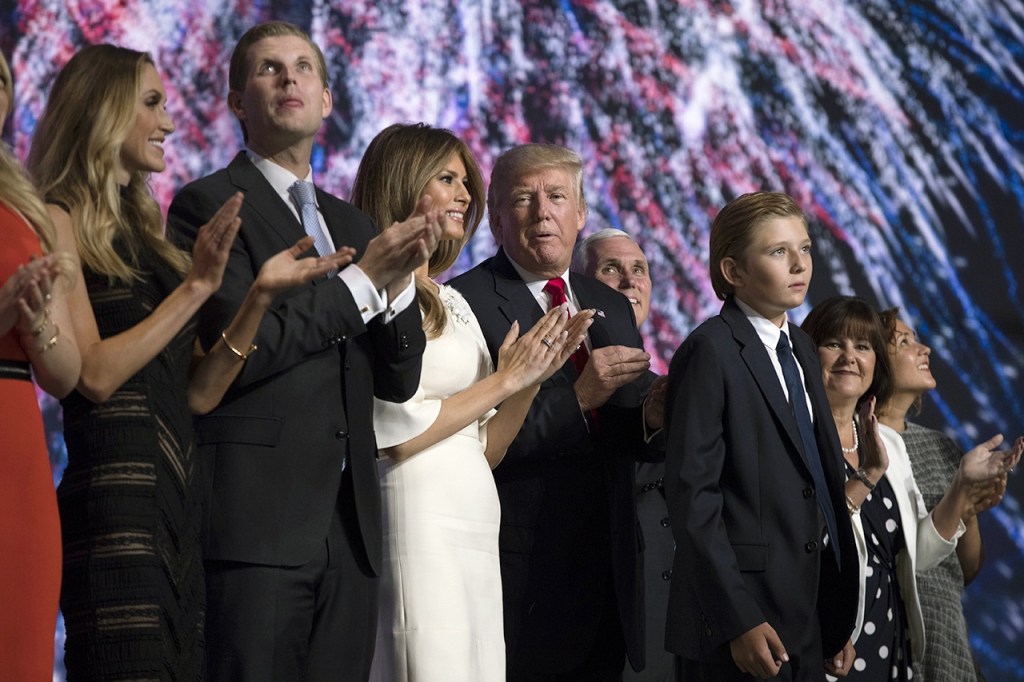Republican presidential candidate Donald Trump celebrates on stage with his family on the final night of the Republican National Convention on Thursday in Cleveland. (AP Photo/Evan Vucci)