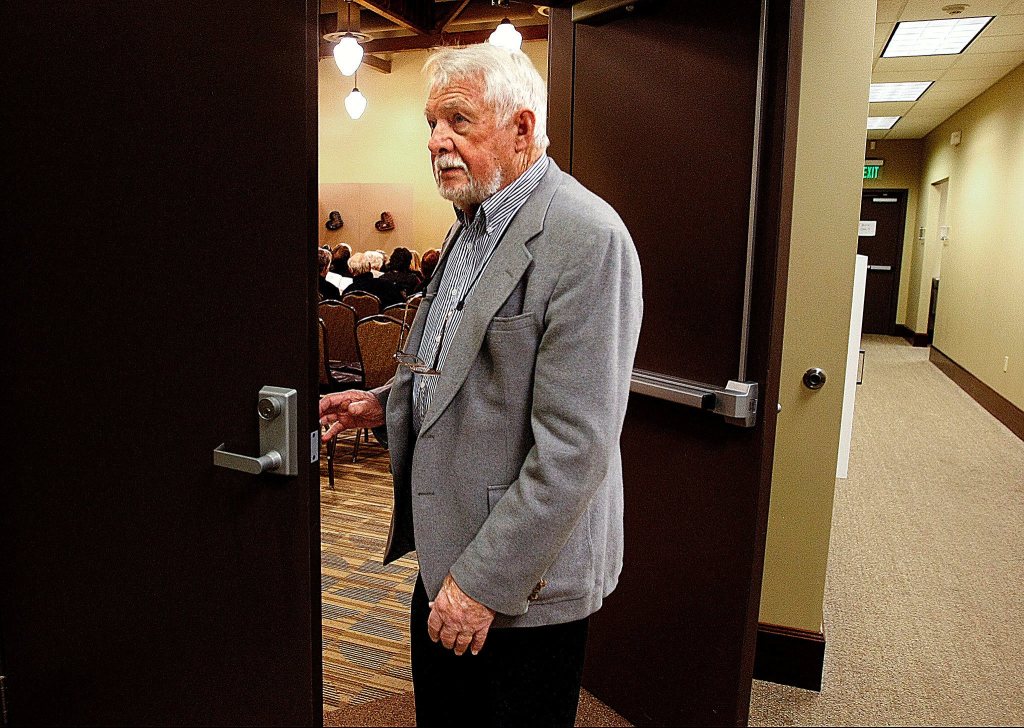 Bob Henry glances toward the lobby as he closes the doors to the house before the final performance of &ldquo;Exit Laughing,&rdquo; in 2009. The long-time Everett High School drama teacher died July 17 at age 92. (Jennifer Buchanan/The Herald)