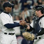 New York Yankees relief pitcher Aroldis Chapman (left) shakes hands with catcher Austin Romine after the Yankees defeated the San Francisco Giants 3-2 Friday in New York. (AP Photo/Julie Jacobson)
