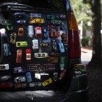 The back of Dave Heykamp&rsquo;s GMC Envoy is seen with Hot Wheels toy cars glued to the car&rsquo;s surface. Heykamp started the project as a way to cope with the death of his wife, Ellen, of 30 years. (Ian Terry / The Herald)