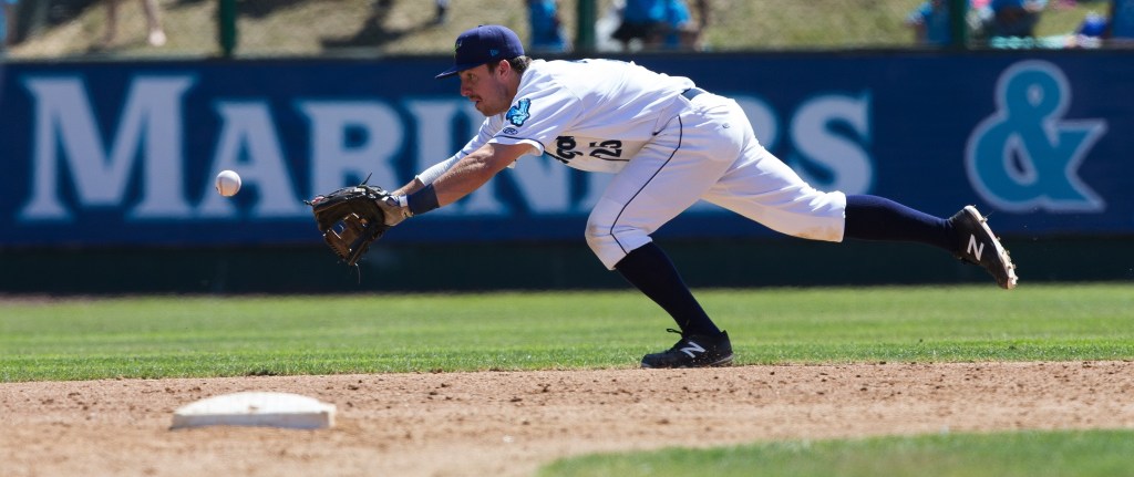 AquaSox Donnie Walton dives for the ball as it bounces past him. The Everett AquaSox beat the Vancouver Canadians 6-5 in the bottom of the ninth inning at Everett Memorial Stadium on Wednesday, July 27, 2016 in Everett, Wa. ( Andy Bronson / The Herald )