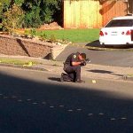 Lynnwood Police Officer Burke works at a crime scene involving shots fired from occupants of one vehicle at occupants of another vehicle in Lynnwood. (Lynnwood PD)