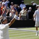 Roger Federer celebrates match point after beating Marin Cilic in a men&rsquo;s quarterfinal match at Wimbledon on Wednesday in London. (AP Photo/Ben Curtis)