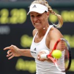 Angelique Kerber returns to Serena Williams on Saturday during the women&rsquo;s singles final at Wimbledon in London. Williams won in straight sets to claim her 22nd major championship, tying Steffi Graf for most in the Open era. (Adam Davy/Pool Photo via AP)