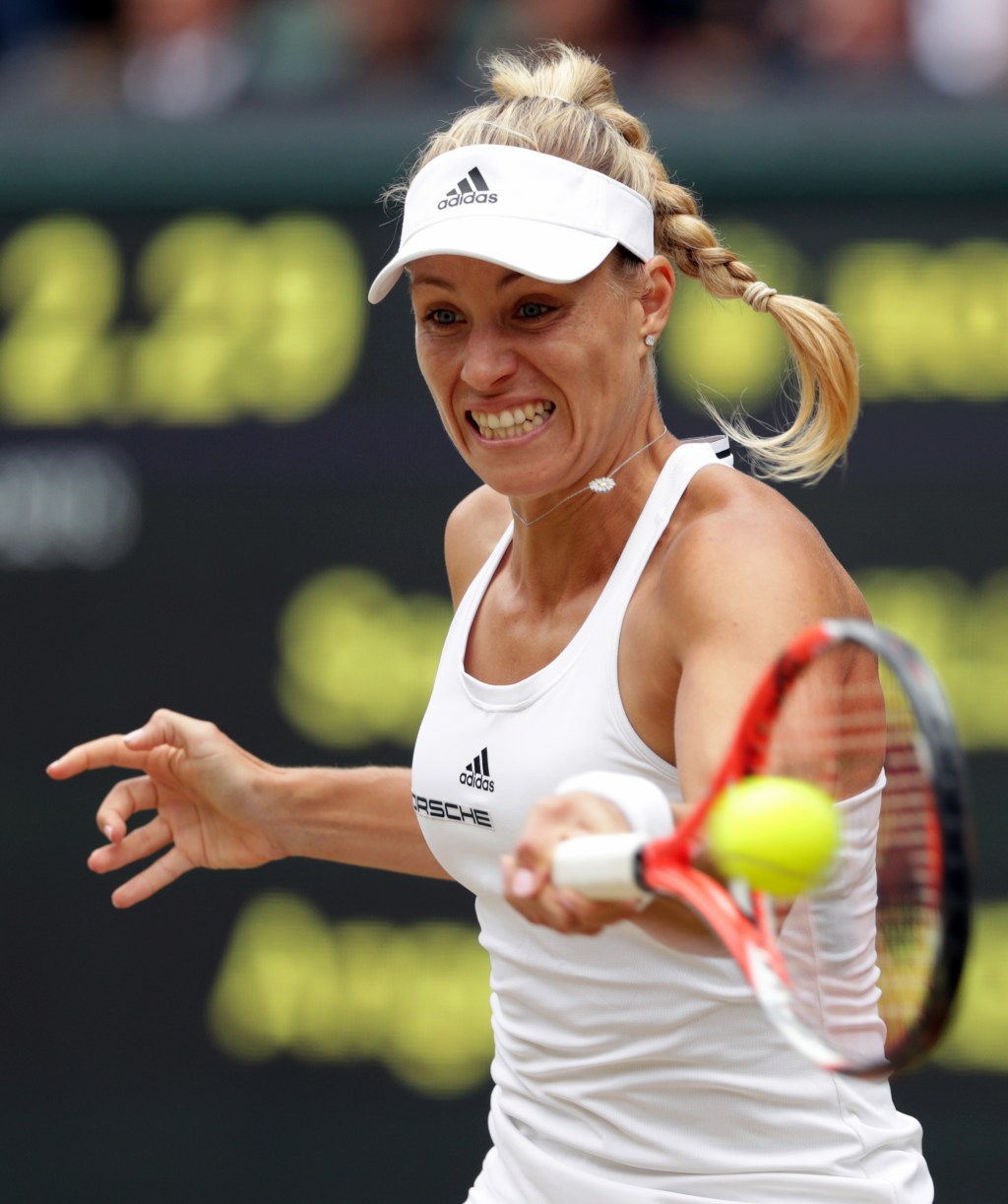 Angelique Kerber returns to Serena Williams on Saturday during the women&rsquo;s singles final at Wimbledon in London. Williams won in straight sets to claim her 22nd major championship, tying Steffi Graf for most in the Open era. (Adam Davy/Pool Photo via AP)