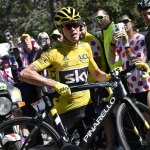 Britain&rsquo;s Chris Froome, wearing the overall leader&rsquo;s yellow jersey, runs with his bike after a crash at the end of the twelfth stage of the Tour de France on Thursday near Mont Ventoux, France. (Jeff Pachoud/ Pool Photo via AP)