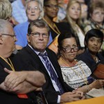 Chattanooga women&rsquo;s basketball coach Jim Foster (left) and UConn women&rsquo;s basketball coach Geno Auriemma (second from left) wait for the start of a ceremony to celebrate the life of former Tennessee women&rsquo;s basketball coach Pat Summitt Thursday in Knoxville, Tenn. Summitt died June 28 at the age of 64.