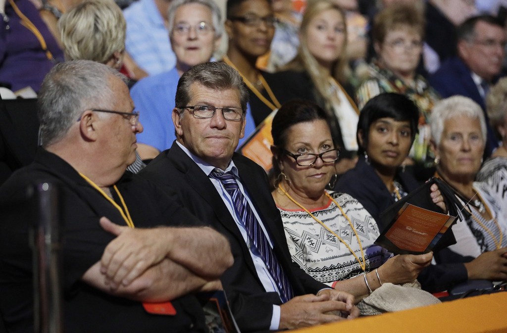Chattanooga women&rsquo;s basketball coach Jim Foster (left) and UConn women&rsquo;s basketball coach Geno Auriemma (second from left) wait for the start of a ceremony to celebrate the life of former Tennessee women&rsquo;s basketball coach Pat Summitt Thursday in Knoxville, Tenn. Summitt died June 28 at the age of 64.