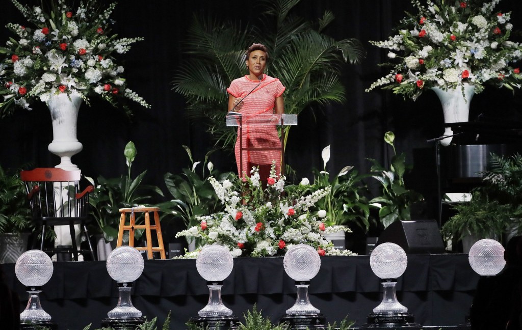Television host Robin Roberts serves as the master of ceremonies during a ceremony to celebrate the life of former Tennessee women&rsquo;s basketball coach Pat Summitt on Thursday in Knoxville, Tenn. In front of the stage are some of the eight national championship trophies Summit won. Summitt died June 28 at the age of 64. (AP Photo/Mark Humphrey)