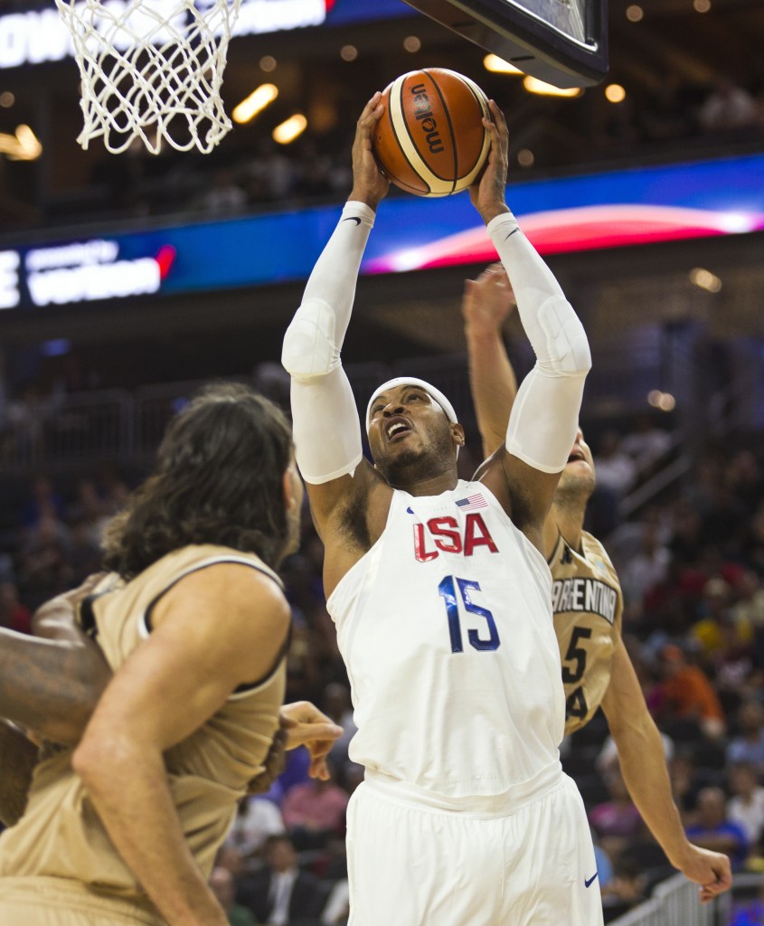 United States forward Carmelo Anthony (15) looks to shoot as Argentina forward Luis Scola (left) defends during Team USA&rsquo;s 111-74 win in an exhibition game Friday in Las Vegas. (AP Photo/L.E. Baskow)