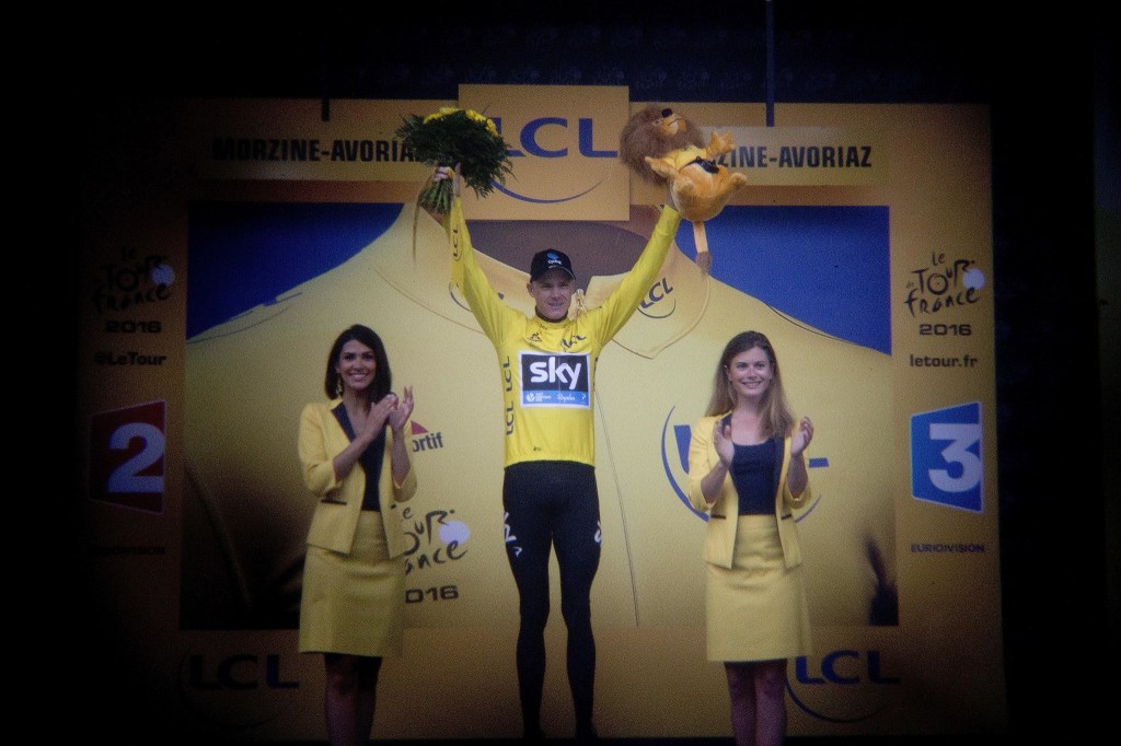 Britain&rsquo;s Chris Froome, wearing the overall leader&rsquo;s yellow jersey, celebrates on the podium after the penultimate stage of the Tour de France on Saturday in Morzine, France. (AP Photo/Peter Dejong)