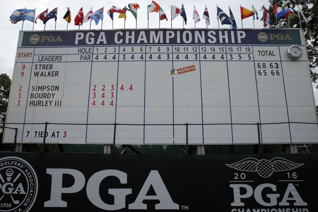 A scoreboard shows a weather warning during a delay in the third round of the PGA Championship at Baltusrol Golf Club in Springfield, N.J. on Saturday. (AP Photo/Tony Gutierrez)