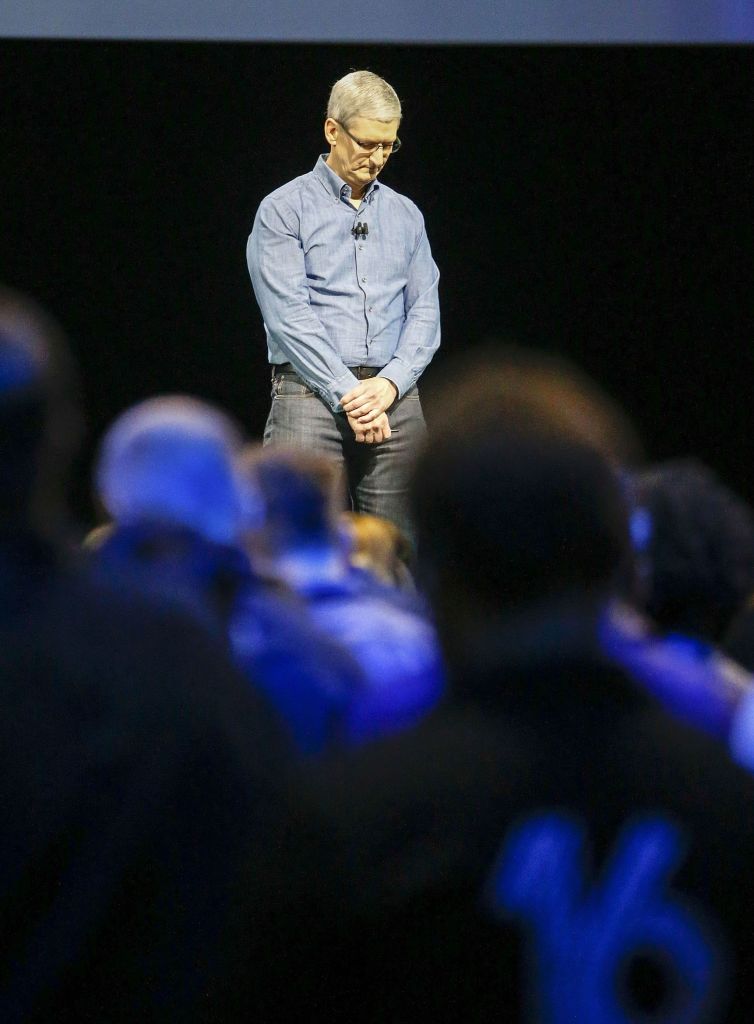 Apple CEO Tim Cook observes a moment of silence in remembrance of the victims of the mass shooting in Orlando, Florida, at the Apple Worldwide Developers Conference on Monday.