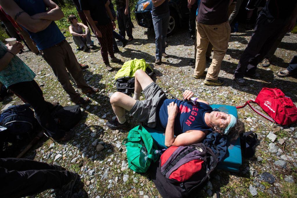 Richard Ellison of Seattle rests on his bouldering pads after working to clear trails April 16 near Gold Bar.