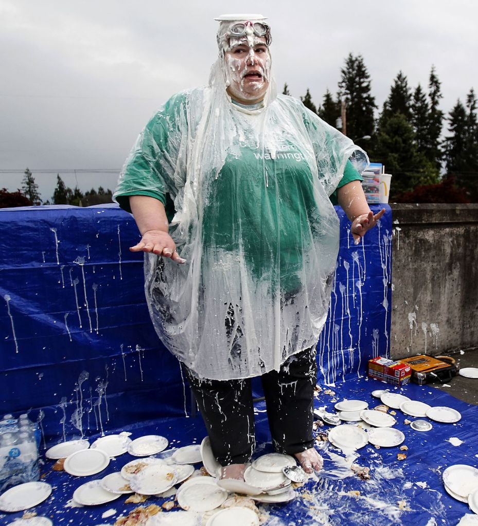 Tina Fish appears to gesture, &ldquo;No more pies!&rdquo; or perhaps, &ldquo;No photos!&rdquo; but the Girl Scout leader remains a very good sport right down to the clean-up.