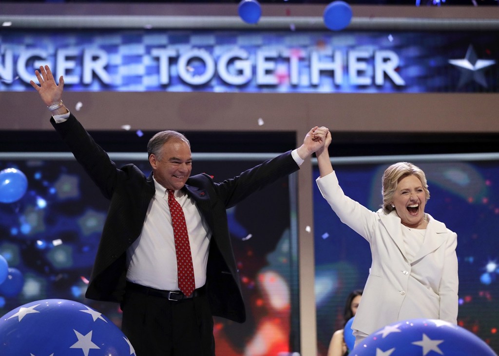 Hillary Clinton is joined by Democratic vice presidential candidate, Sen. Tim Kaine, after her speech at the Democratic National Convention in Philadelphia on Thursday. (AP Photo/Matt Rourke)