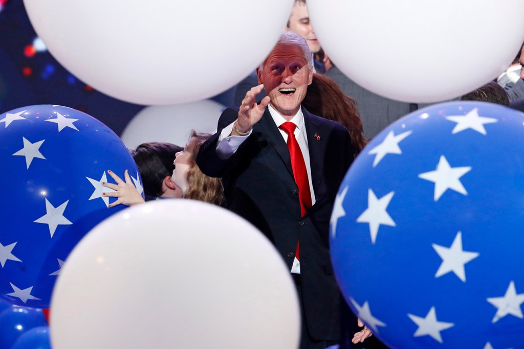 Former President Bill Clinton enjoys the falling balloons at the conclusion of the Democratic National Convention in Philadelphia on Thursday. (AP Photo/J. Scott Applewhite)
