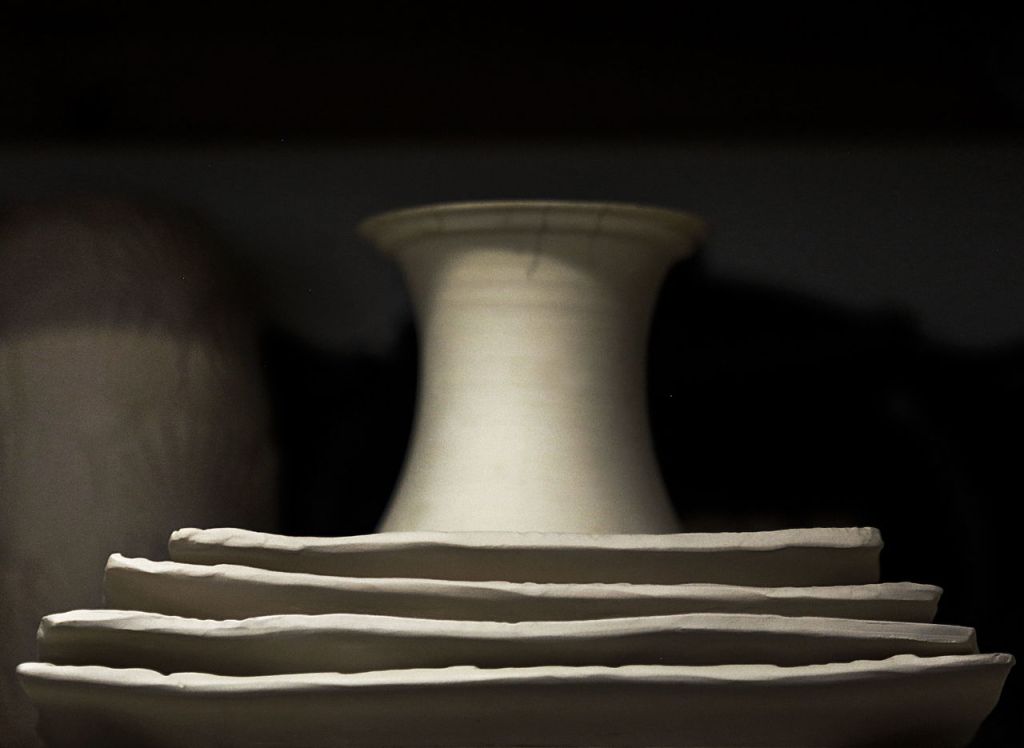 Shapes peek out from the shelf shadows in Goff&rsquo;s studio.