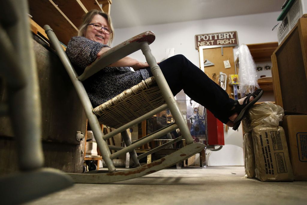 Goff relaxes in an old family rocking chair in her studio.