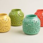 Scatter a few cutout glazed ceramic lanterns in your chosen palette and set your mood (worldmarket.com).