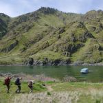 A Hells Canyon jet boat tour operator motors into the shore at Upper Pittsburg Landing to pick up a load of Spokane Mountaineers who&rsquo;d booked a shuttle 26 miles upstream in order to hike back on Snake River Trail 102 from Granite Creek.