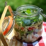 Layered caprese pasta salad can be packed in a jar and tossed in a cooler.