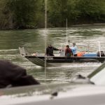 Tribal fish and game officers watch fishermen head upriver while drift net fishing on the Skagit River on Thursday in Mount Vernon.
